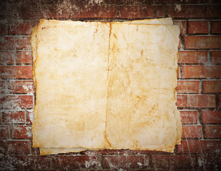 Old paper on brick wall