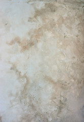 Brick wall with peeling plaster