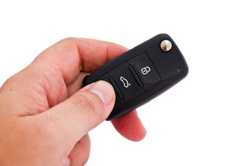 Fototapeta premium Man hand holding a garage door remote control
