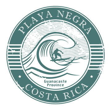 Stamp with surfer on wave and name of Playa Negra, Costa Rica