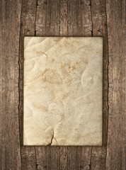 old paper sheet over rustic wooden background