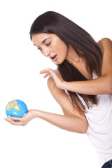 beautiful young woman holding a globe in hand...