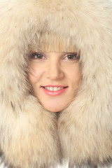 portrait of blonde girl in warm jacket with a hood