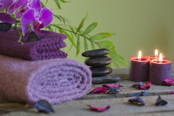 Spa still life with zen stones aromatic candles and orchids