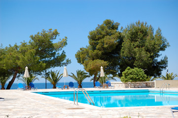 Swimming pool by a beach at the luxury hotel, Halkidiki, Greece