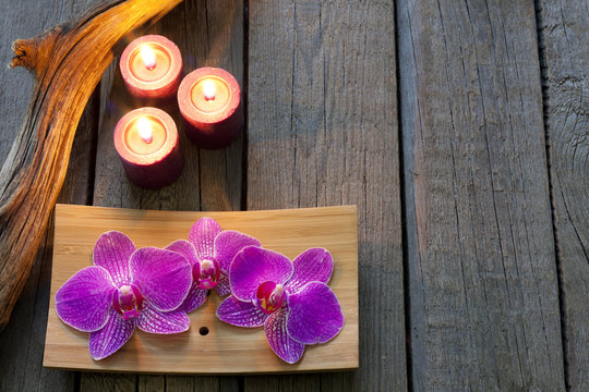 Orchids and candle spa cosmetic background abstract