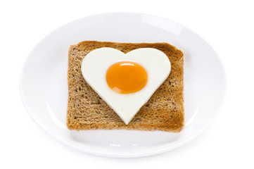 heart shaped cooked egg on toast