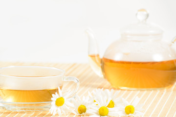 teacup with herbal chamomile tea