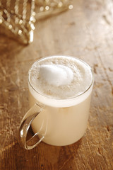 golden homemade coffee latte on wood and glitter ....