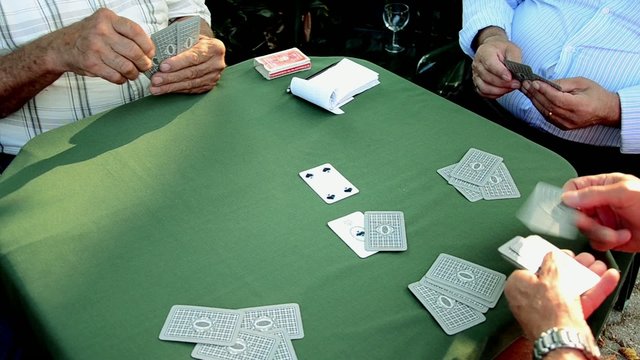 Old man man distributes cards