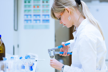 Female researcher carrying out research experiments