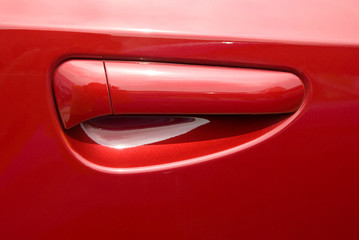 red car door handle - Powered by Adobe