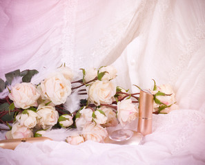 The beautiful bridal perfume bottles and white roses