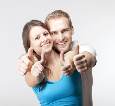 couple showing thumbs up