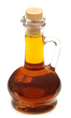 Edible mustard oil in a transparent glass jar