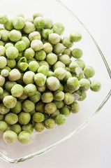 frozen peas close up in white background