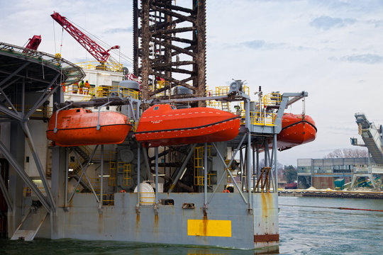 Lifeboats on an oil rig.