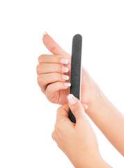 Woman polishing fingernails with nail file, isolated on white