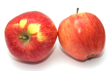 Two red apples on a white background