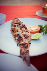 grilled fish in зlate om sunset