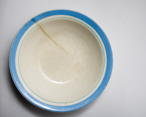 old bowl on a white background
