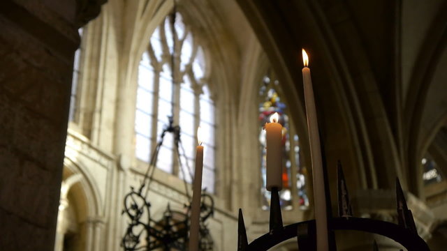 Illuminated candles in a cathedral