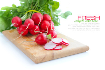 Fresh radish on a wooden board isolated on white background