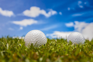 Golf theme on green grass and sky background