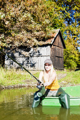 fishing woman sitting on boat