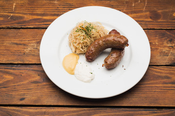 Sausages and old wooden table