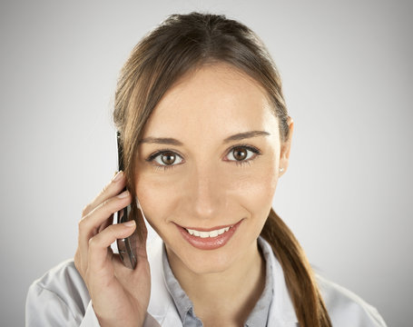 young medical woman calling by mobile phone