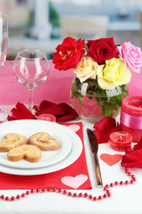 Table setting in honor of Valentine's Day on room background