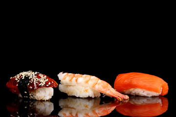 delicious sushi isolated on black