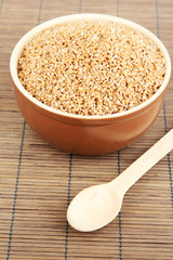 Brown bowl full of wheat bran
