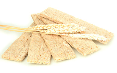 Oat biscuits and wheat ears isolated on white