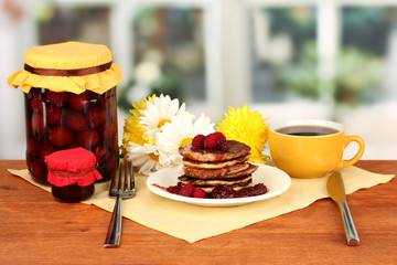delicious sweet pancakes on bright background