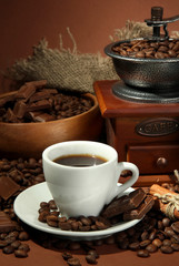 cup of coffee, grinder, turk and coffee beans
