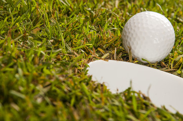 Golf stuff on sunny golf field