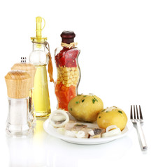 Dish of herring and potatoes on plate isolated on white
