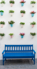 Blue bench with flower pots