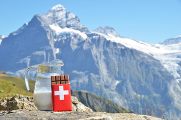 Swiss chocolate and jug of milk. Switzerland