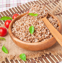 Buckwheat porridge in a wooden bowl 
