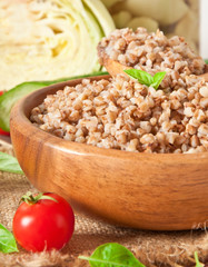 Buckwheat porridge in a wooden bowl 
