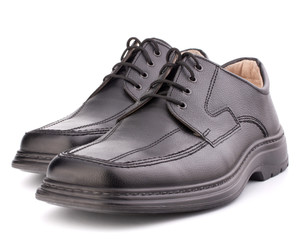Black glossy man’s shoes with shoelaces