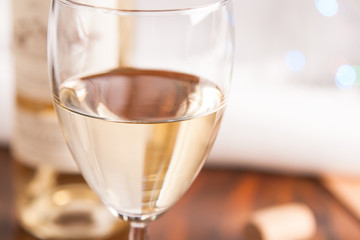 glass and bottle white wine on blink light