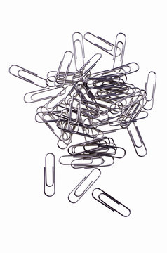 Metal paper clips, isolated over white