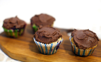 Blueberry muffins with chocolate butter icing