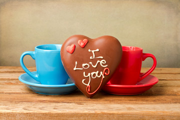 Coffee cups and heart shape chocolate for Valentine's Day