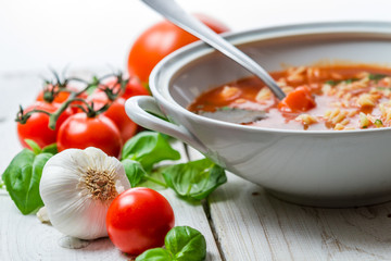 Close-up on tomato soup made ​​of garlic and basil