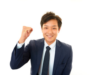 ガッツポーズをする笑顔のビジネスマン